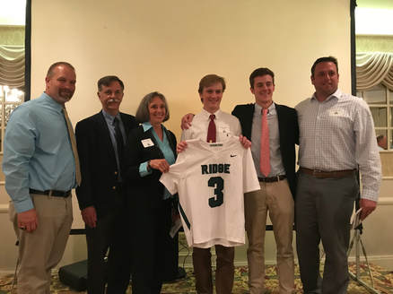Pictured from left to right: 
Coach Marsh, Mr. and Mrs. Shaw, Wes Hudkins, former #3 jersey recipient Michael Harris, and Coach Mack
​
(Award presented end of 2018 season)